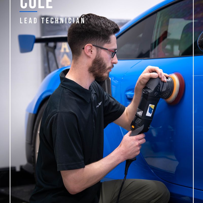 Cole, HD lead technician, on a paint correction